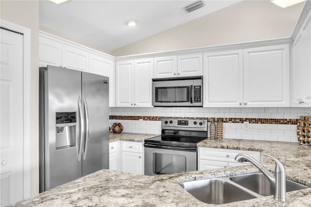 kitchen with stainless steel appliances, white cabinetry, and sink