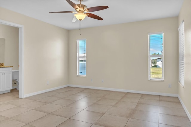 unfurnished room featuring light tile patterned floors and ceiling fan