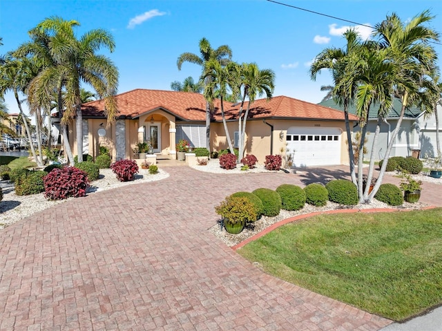 mediterranean / spanish house featuring a garage