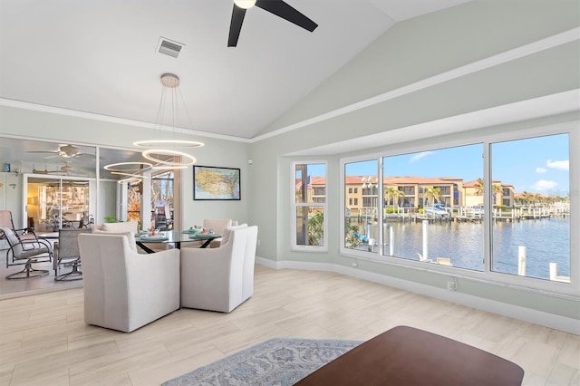 interior space with a water view, high vaulted ceiling, and ceiling fan with notable chandelier