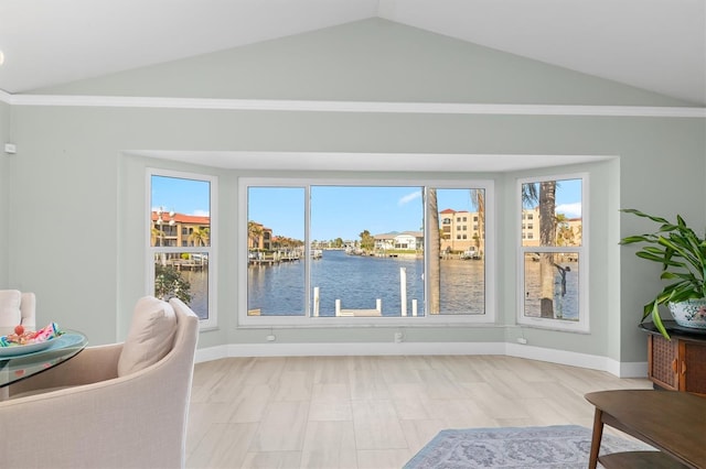 interior space featuring a water view and vaulted ceiling