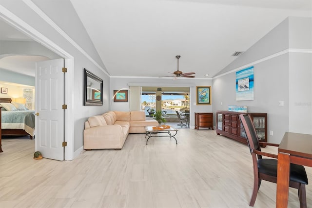 living room featuring light hardwood / wood-style flooring, vaulted ceiling, and ceiling fan