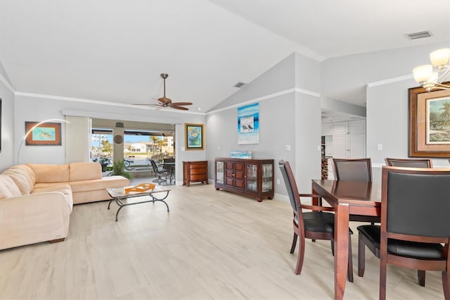 living room featuring lofted ceiling, ceiling fan with notable chandelier, and light hardwood / wood-style floors