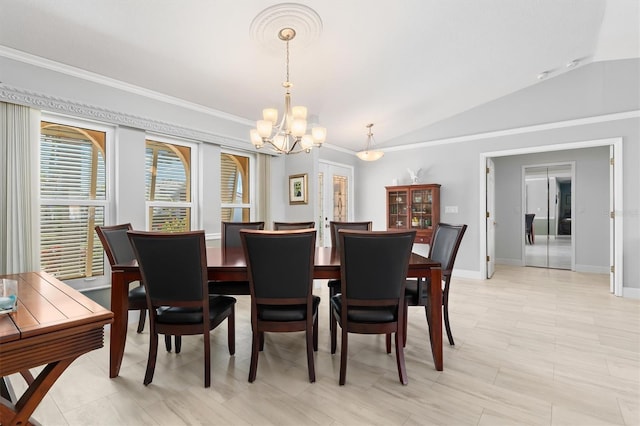 dining room featuring an inviting chandelier, vaulted ceiling, and ornamental molding