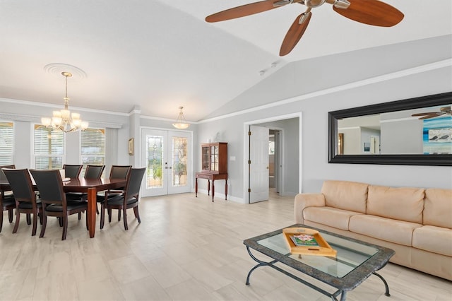 living room featuring vaulted ceiling, ornamental molding, ceiling fan with notable chandelier, and french doors