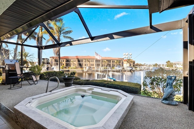 view of pool with a water view, an outdoor hot tub, a grill, and a lanai