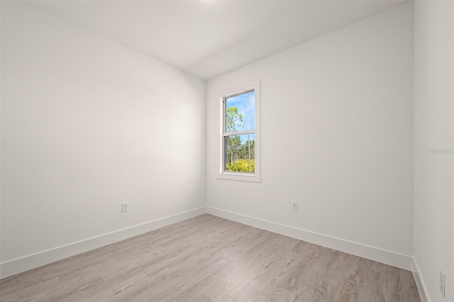 unfurnished room with light wood-type flooring