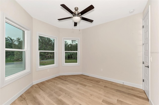 spare room with ceiling fan and light hardwood / wood-style floors