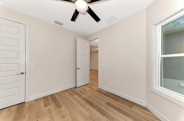 unfurnished bedroom featuring ceiling fan and light hardwood / wood-style floors