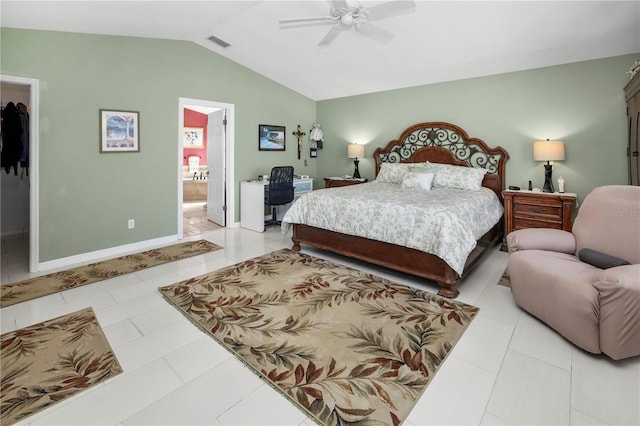 bedroom with vaulted ceiling, ensuite bathroom, ceiling fan, and light tile patterned flooring