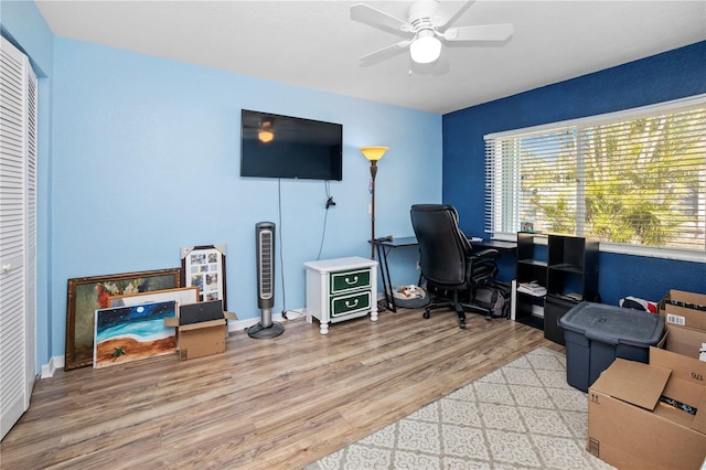 office area with wood-type flooring and ceiling fan