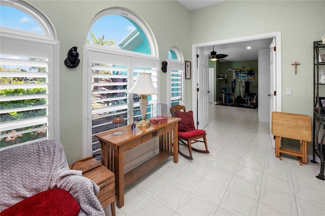 living area with ceiling fan