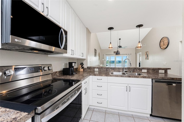 kitchen featuring white cabinetry, appliances with stainless steel finishes, sink, and pendant lighting