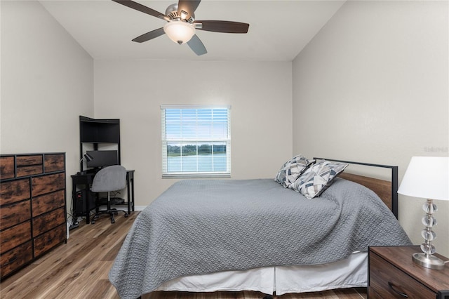 bedroom featuring wood-type flooring and ceiling fan