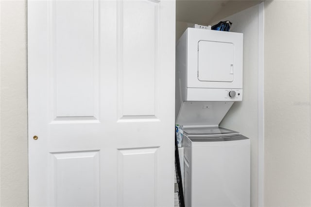 laundry room featuring stacked washer / dryer