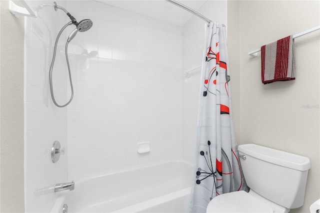 bathroom featuring shower / bathtub combination with curtain and toilet