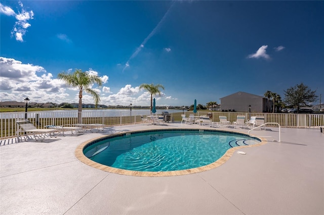 view of swimming pool featuring a patio area