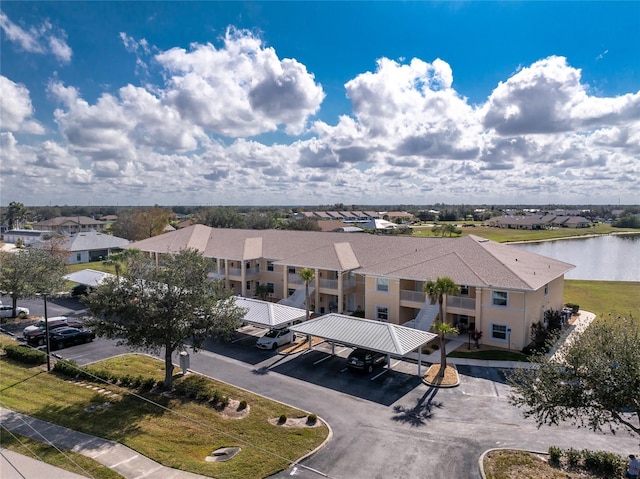 birds eye view of property with a water view