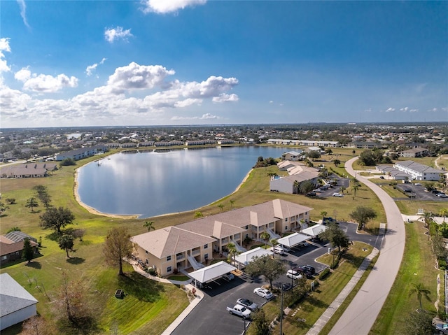 birds eye view of property with a water view