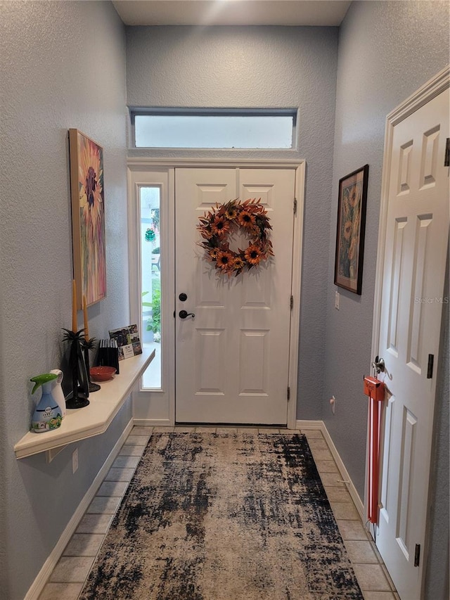 view of tiled foyer entrance