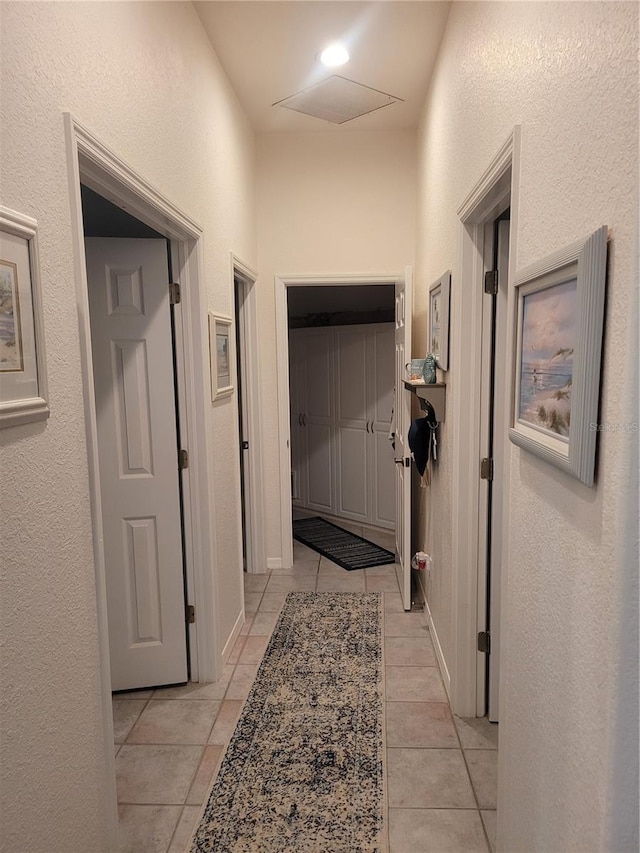 hallway with light tile patterned floors