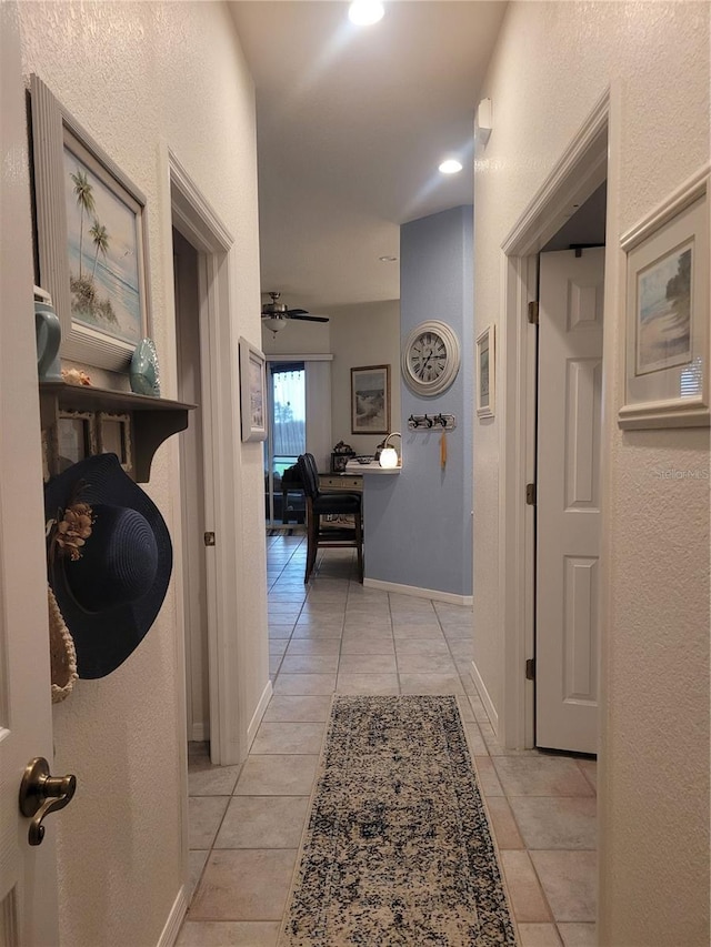 corridor with light tile patterned floors