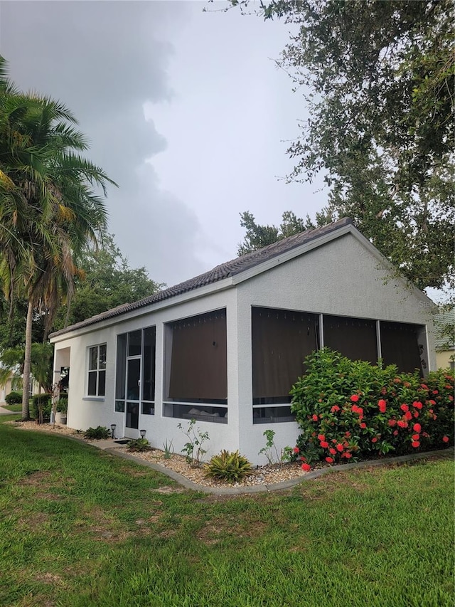 view of home's exterior featuring a lawn