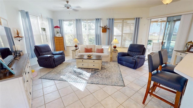 tiled living room with ceiling fan