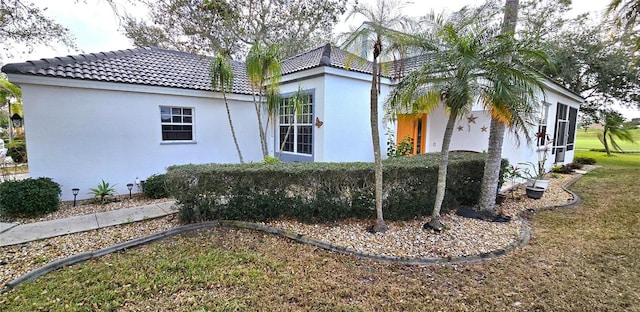 view of property exterior featuring a yard