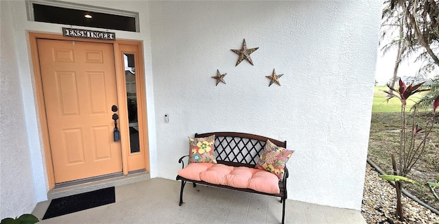 doorway to property with a porch