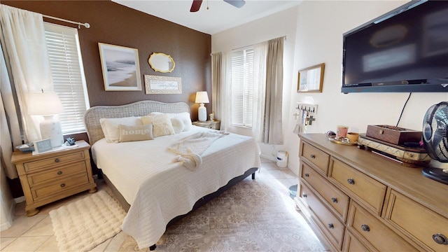 tiled bedroom with ceiling fan