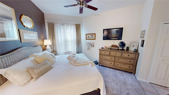 bedroom with light tile patterned floors and ceiling fan