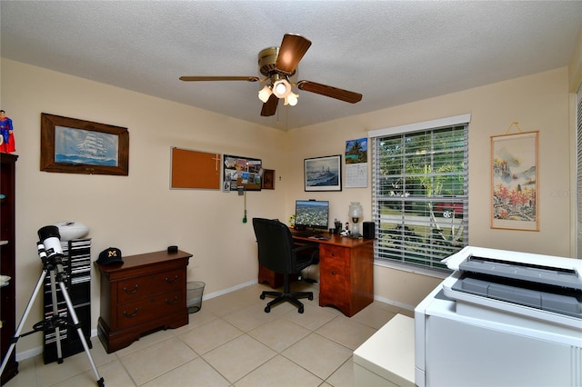 office space with ceiling fan, light tile patterned floors, and a textured ceiling