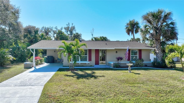 single story home with a carport and a front lawn