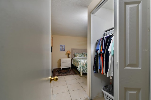 interior space with a closet and a textured ceiling