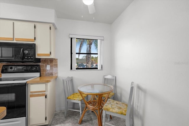 kitchen with tasteful backsplash, range with electric cooktop, a ceiling fan, light countertops, and black microwave