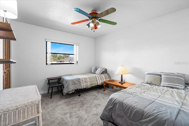 bedroom with carpet floors, baseboards, and a ceiling fan