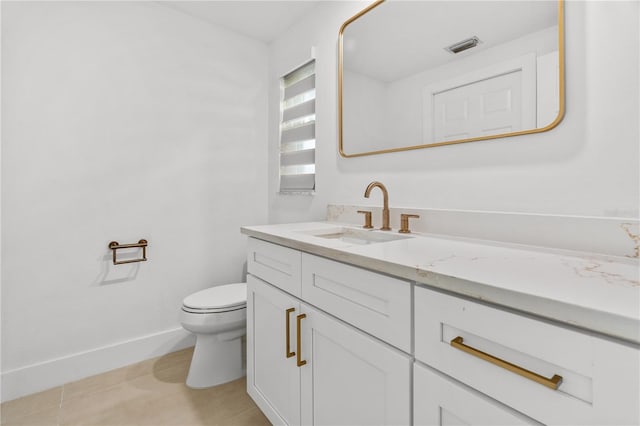 half bath with visible vents, baseboards, toilet, tile patterned floors, and vanity