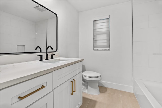 bathroom with toilet, visible vents, baseboards, vanity, and tile patterned floors