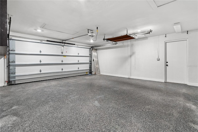 garage featuring baseboards and a garage door opener