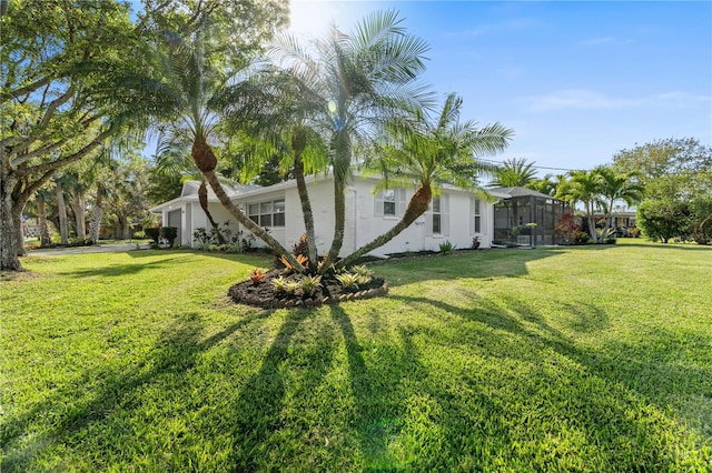 view of yard featuring a lanai