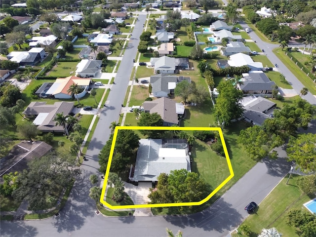 birds eye view of property with a residential view