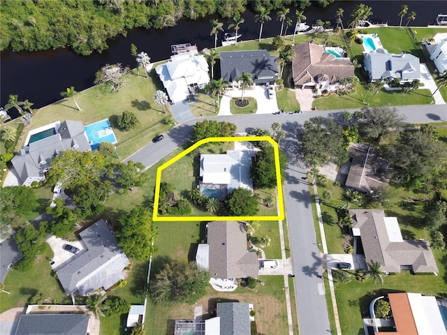 bird's eye view featuring a residential view and a water view