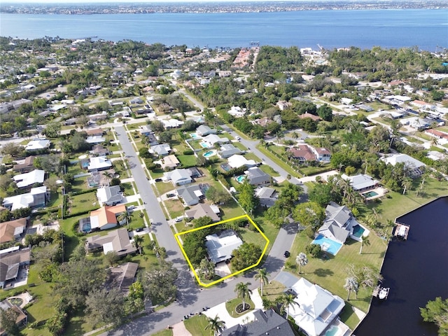 birds eye view of property featuring a water view and a residential view