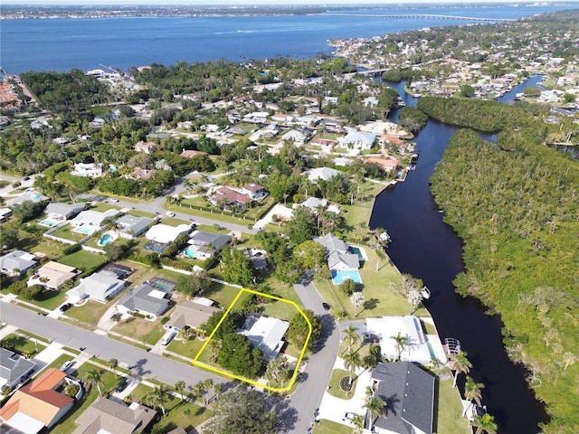 drone / aerial view with a water view and a residential view