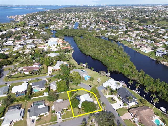 bird's eye view featuring a water view and a residential view