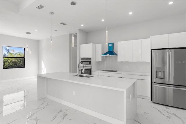 kitchen featuring white cabinets, wall chimney exhaust hood, modern cabinets, stainless steel appliances, and light countertops