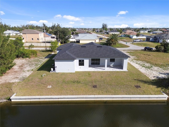 bird's eye view featuring a water view and a residential view