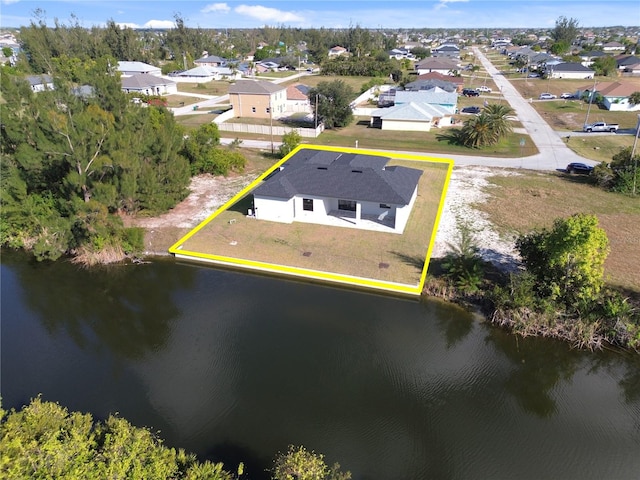 aerial view featuring a water view and a residential view