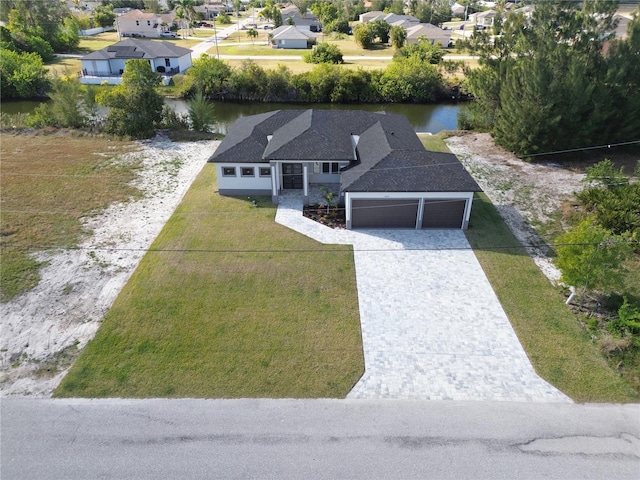 birds eye view of property with a water view